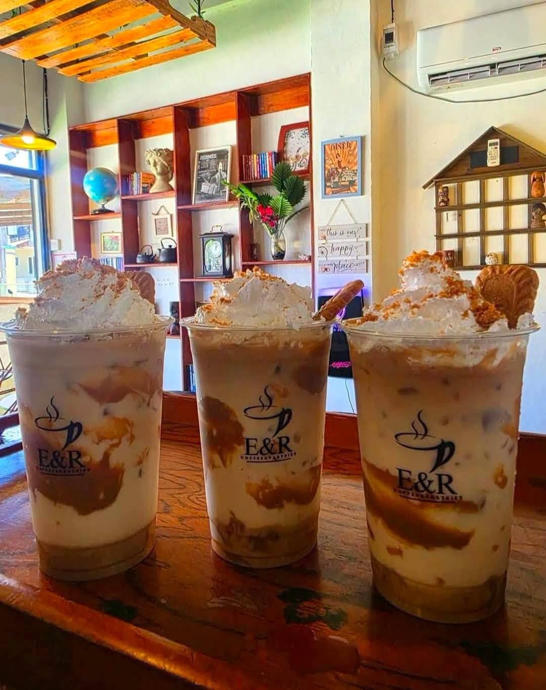 Iced chocolate frappe topped with whipped cream and cookies